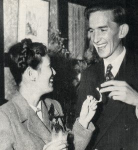 Cherry and Gordon Parker laugh as they pull apart a wishbone at a party welcoming Cherry home as Australia's first Japanese war bride.