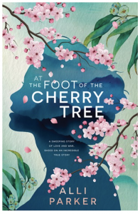 The cover of the novel At the Foot of the Cherry Tree. A woman's face is silhouetted in blue and pink sakura flowers and deep green eucalyptus leaves creep across the image.